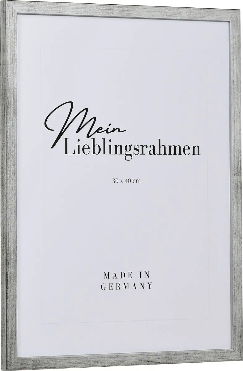 Seitenansicht eines schmalen, silbernen Bilderrahmens mit sichtbarer Holzstruktur und glatter OberflÃ¤che