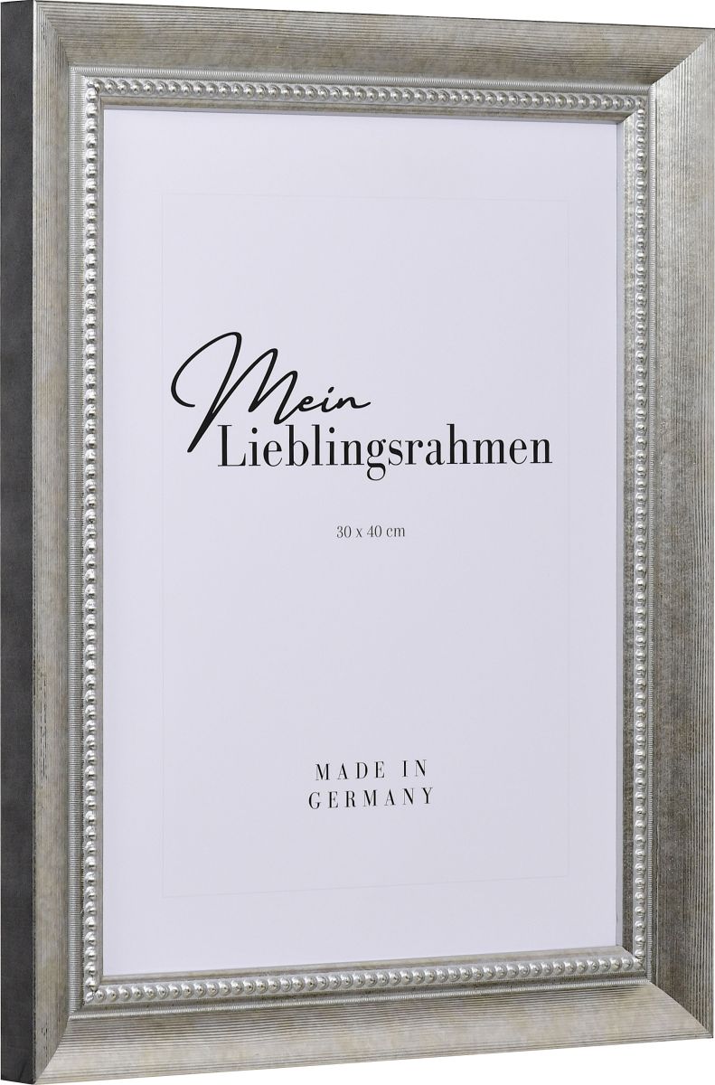 Seitenansicht eines silbernen Bilderrahmens mit einer durch ein PrÃ¤gerad aufgebrachten OberflÃ¤che und einem Perlstab