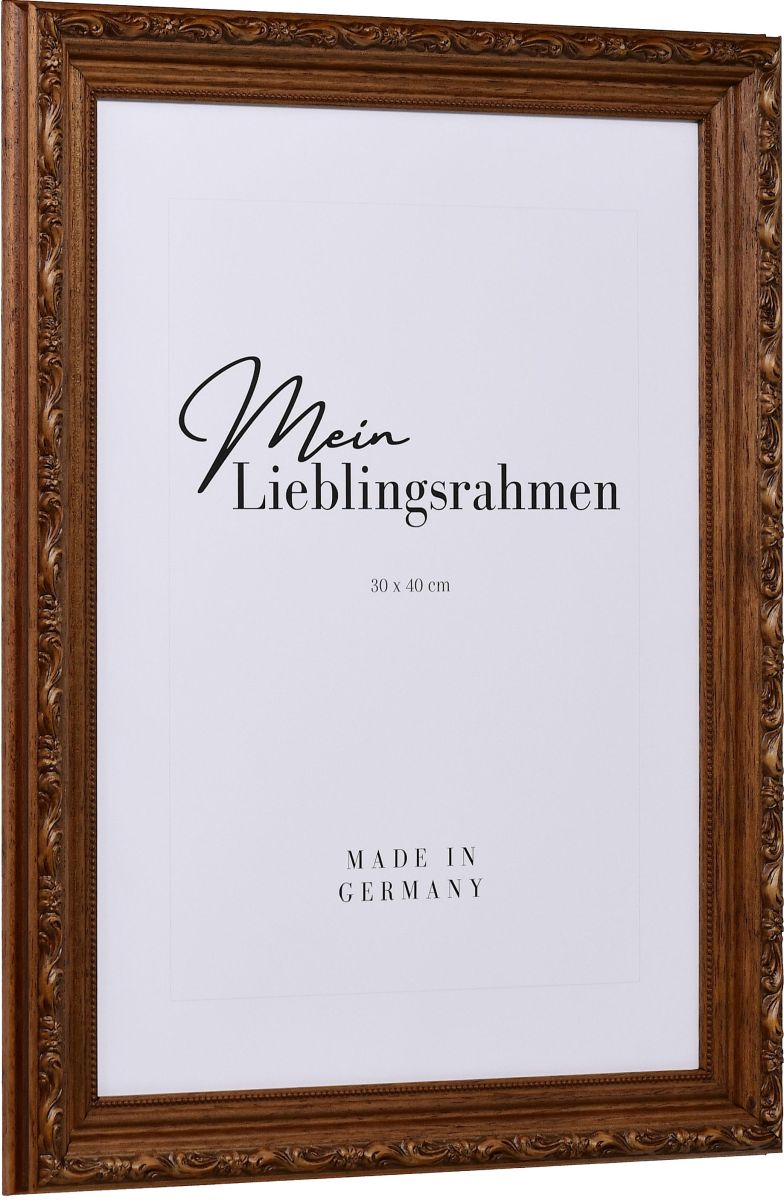 Seitenansicht eines braunen Holzrahmens im Barockstil mit rustikaler, nussbaumgebeizter OberflÃ¤che, leicht schimmernden floralen Ornamenten und einem Perlstab an der Innenkante